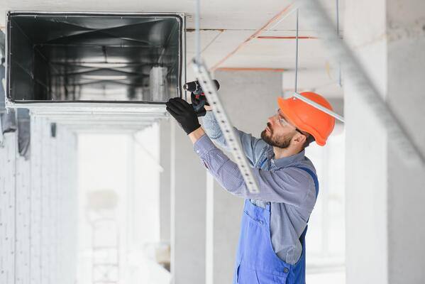 hvac-engineer-install-heat-recovery-ventilation-system-for-new-house-copy-space-photo